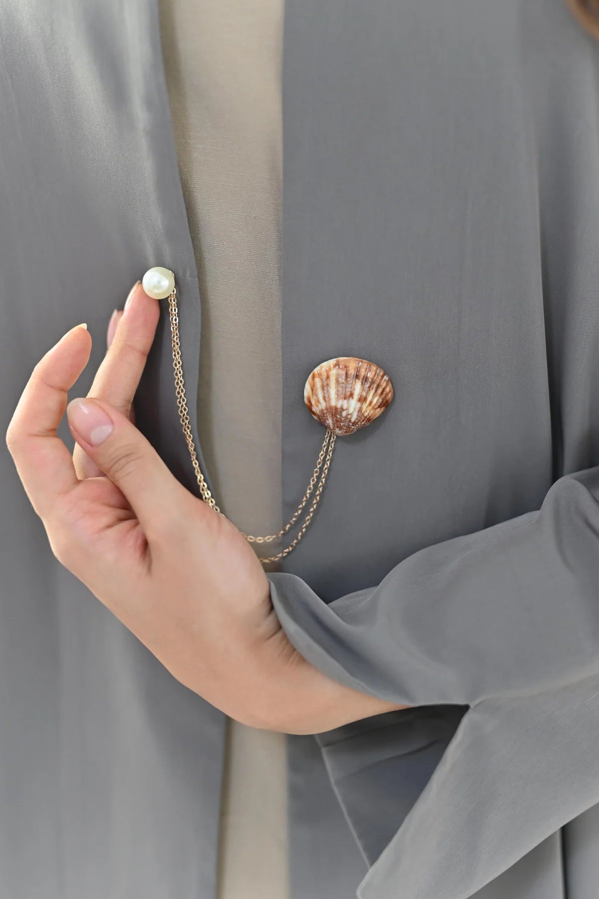 Dana Shell and Pearl Chain Brooch worn on grey abaya