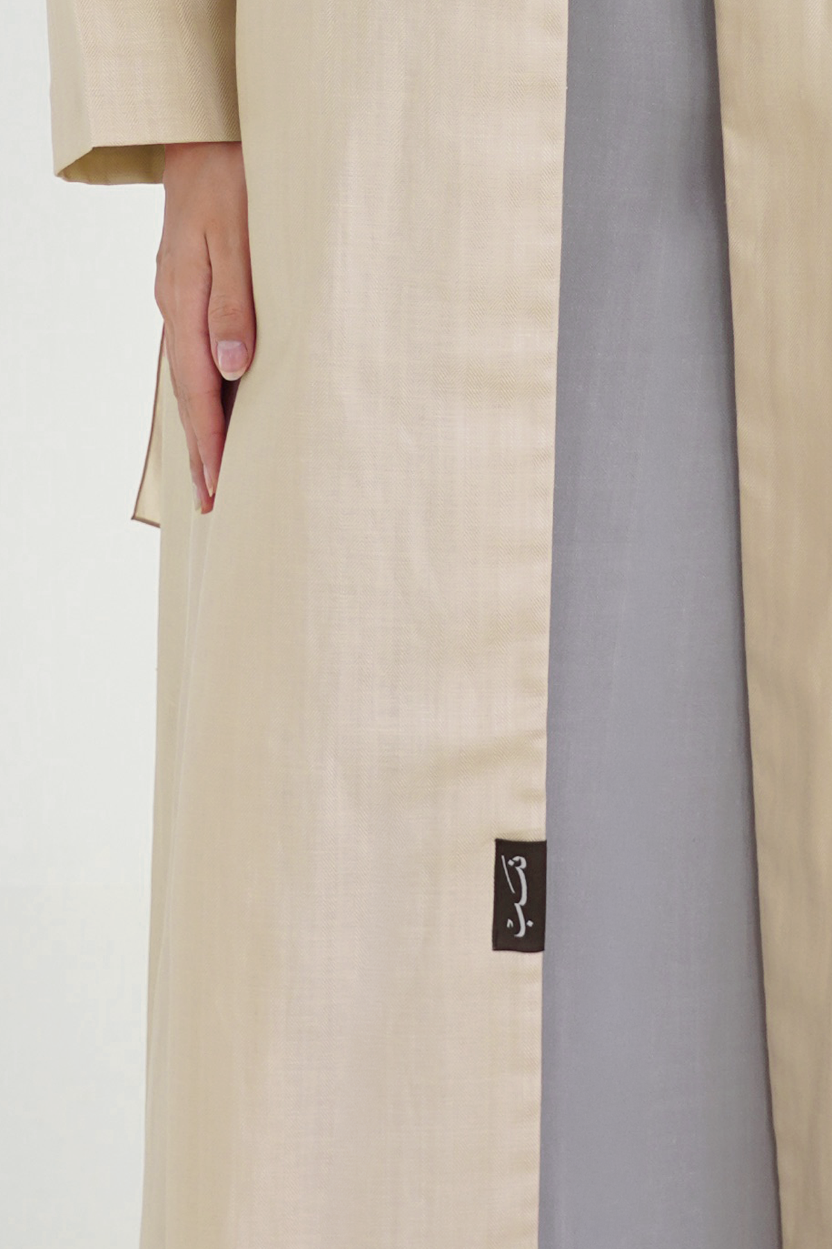 Whimsy Beige abaya NASAB label detail