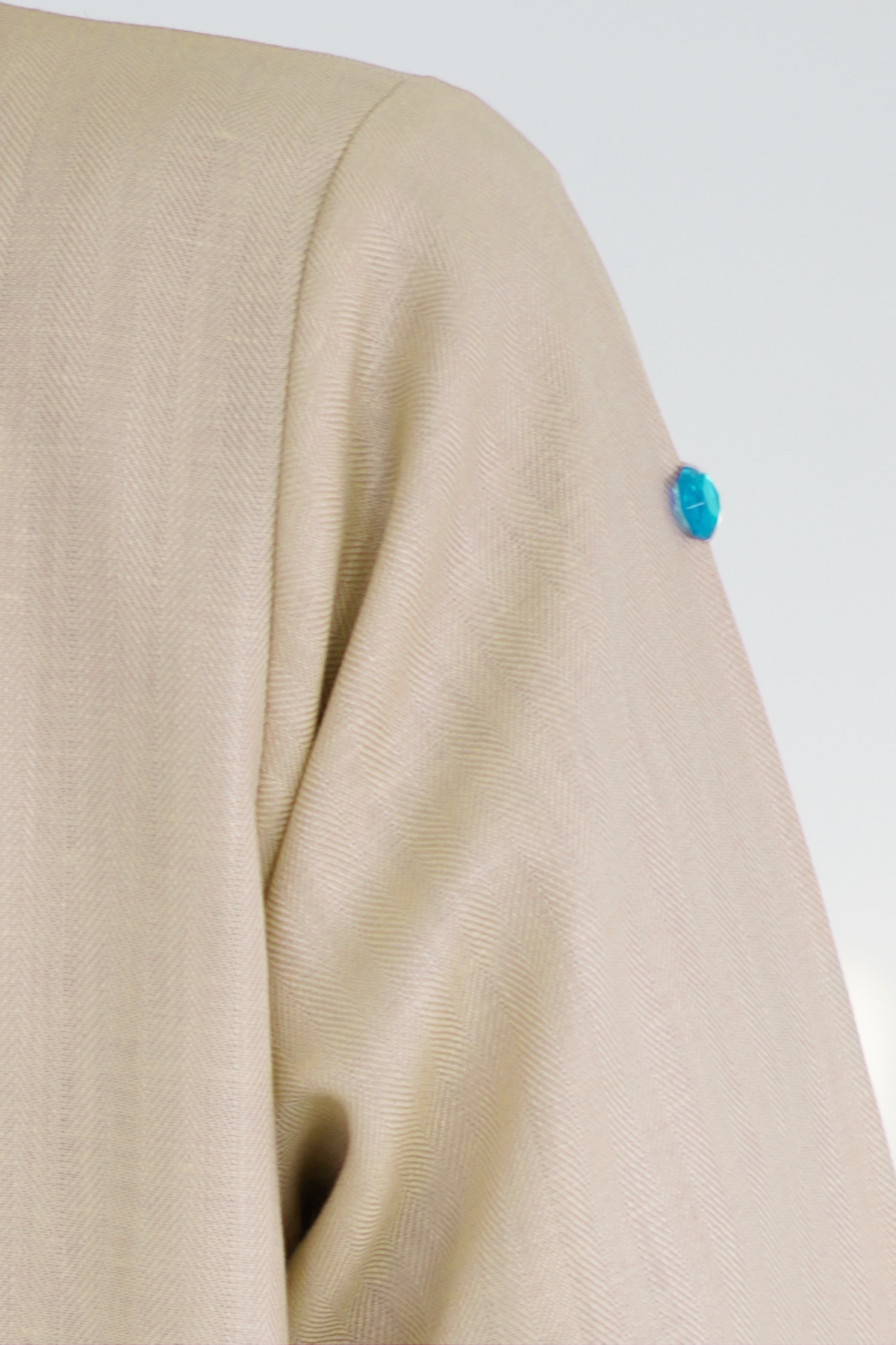 Whimsy Beige abaya fabric and gemstone detail